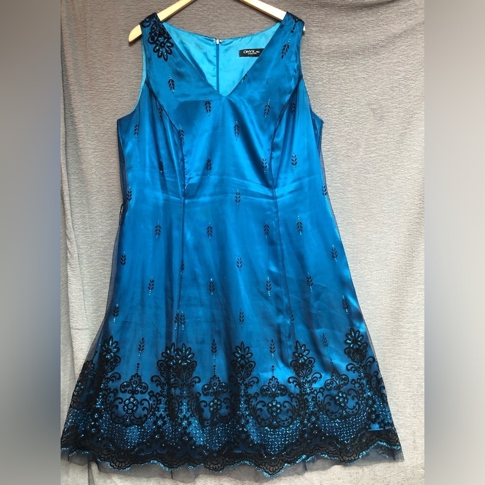Onyx night sleeveless teal satin dress with black mesh overlay, and black design